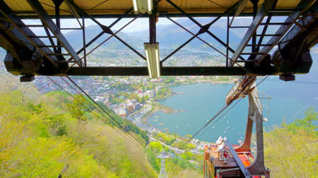 Fujikawaguchiko / Japan - May 02 2019: Funicular descends from the mountain TenjoYama. Landscape...