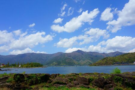 Landscape beautiful Lake Kawaguchiko. Blue sky and blue lake, mountainsの写真素材