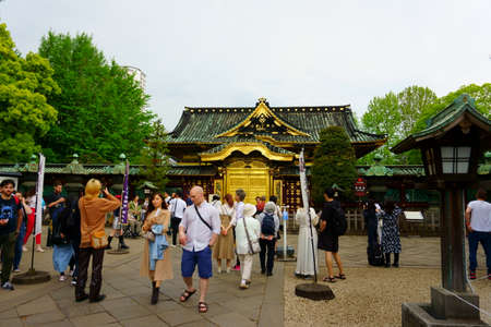 Tokyo / Japan - May 04, 2019: Many visitors of of various nationalities and ages go to temple. Golden doors of Toshogu shrine famous temple in Ueno Parkのeditorial素材