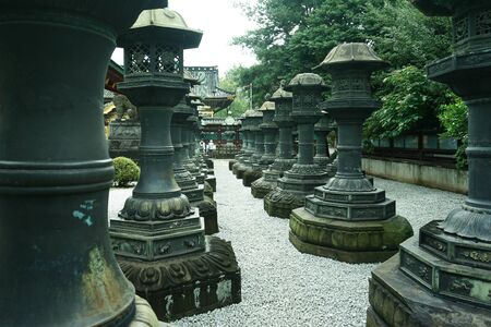Old stone lanterns of shintoism shrine in Tokyo Japanの写真素材