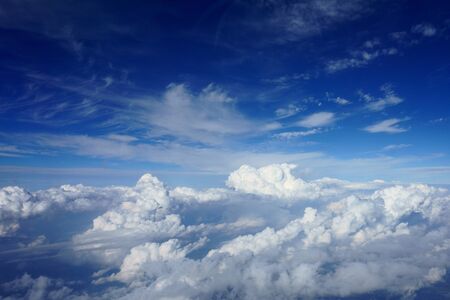 beautiful blue sky with clouds. view from airplane porthole                             