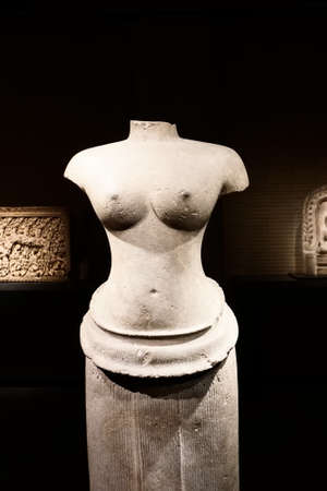 Standing female deity. Sandstone. Angkor period 11th-12th century