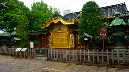 TOKYO, Japan - Sept 11 2018: Golden doors of Toshogu shrine famous temple in Ueno Park. Karamon (Chinese style gate). Gold foil as well as hand curved flowers and birds ornately decorate the doors and both sides of the gateのeditorial素材