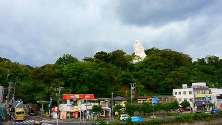 Kamakura, Kanagawa Prefecture Japan - Sept 12, 2019: The serene face that peers over the hillside as you pull into Ofuna Stationのeditorial素材