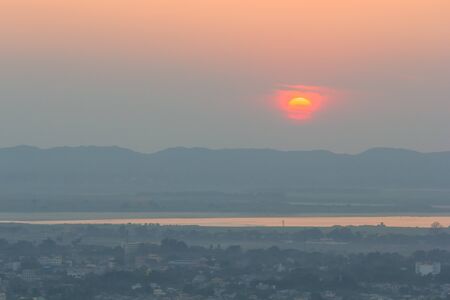 Mandalay cityscapes with sunset background as seen from Mandalay Hills, Myanmar