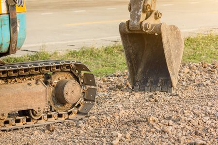 Bucket of the excavator pasted on ground.の写真素材