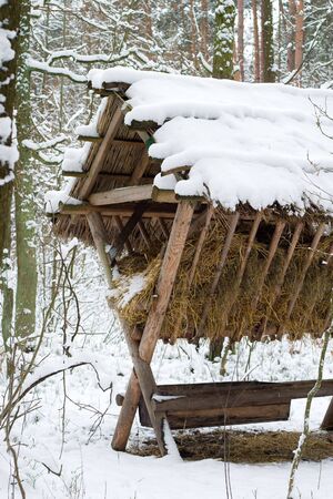 Hunter's design for the feeding of wild animals in winterの写真素材