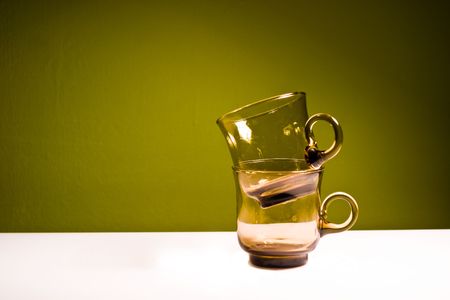 glass vessels standing on the white table, isolated backgroundの写真素材