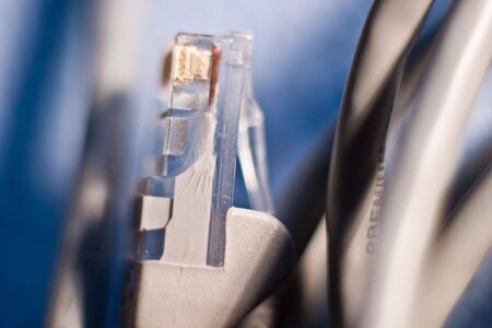 Network cable connector detail isilated on white background
の写真素材
