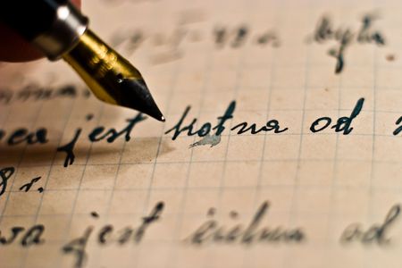 black and gold fountain pen, ink pen on old aged paper

の写真素材