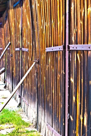 very old antique colored door of the buildingの写真素材