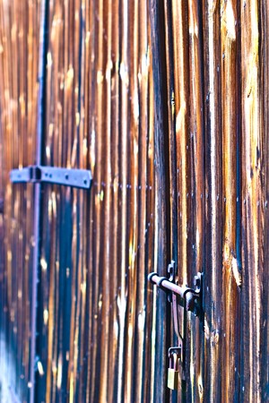 very old antique colored door of the buildingの写真素材