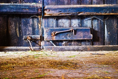 very old antique colored door of the buildingの写真素材