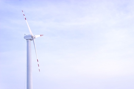 Wind turbines on green field. Alternative source of energy