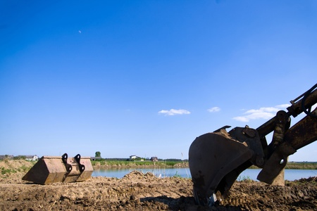 digger, Heavy Duty construction equipment parked at work site の写真素材
