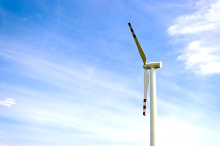 Wind turbines on green field. Alternative source of energy