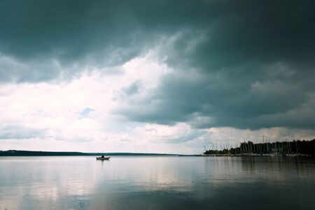 sun behind the clouds on a warm evening, nature seriesの写真素材