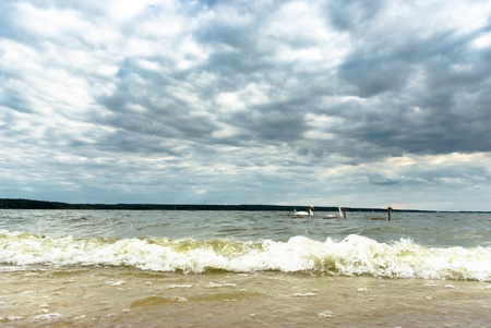 occurring sun behind the clouds on a warm evening, nature seriesの写真素材
