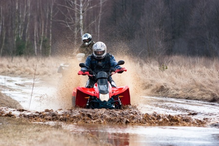 male riding a quad, four wheeler in rural, sport seriesのeditorial素材