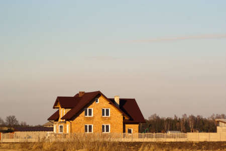 family home with garage, family house over blue sky, hauses seriesのeditorial素材