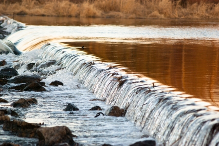 Water plummets many feet down the face  in eastern Polandの写真素材