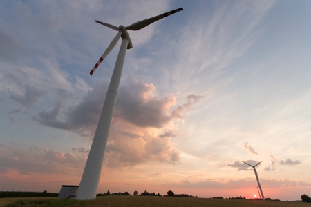 Wind turbines on green field. Alternative source of energy