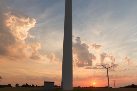Wind turbines on green field. Alternative source of energy