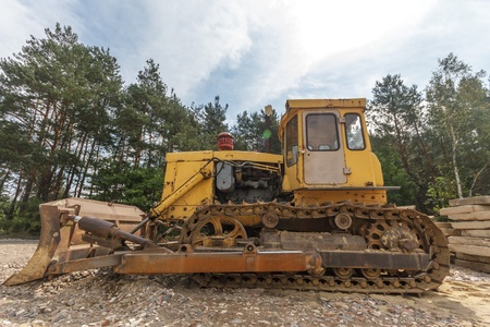 digger, heavy duty construction equipment parked at work siteの写真素材