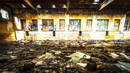 Discarded ruin with old windows and wall, industrial window in concrete wallのeditorial素材