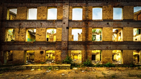Discarded ruin with old windows and wall, industrial window in concrete wallのeditorial素材