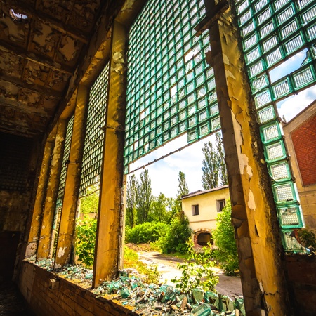 Discarded ruin with old windows and wall, industrial window in concrete wallのeditorial素材