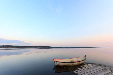 boat on the blue lake with cloudy sky, nature seriesの写真素材