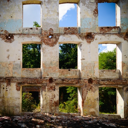 discarded ruin with old windows and wall, industrial window in concrete wallの写真素材