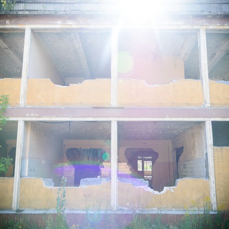 discarded ruin with old windows and wall, industrial window in concrete wallの写真素材