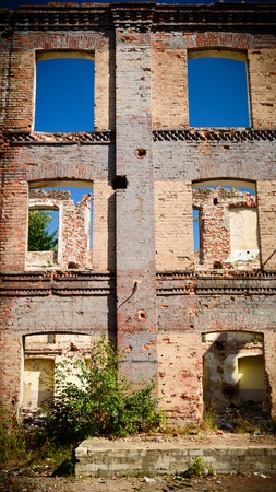 discarded ruin with old windows and wall, industrial window in concrete wallの写真素材