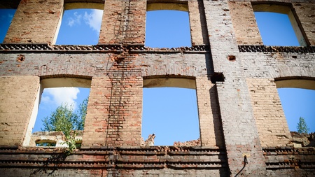 discarded ruin with old windows and wall, industrial window in concrete wallの写真素材