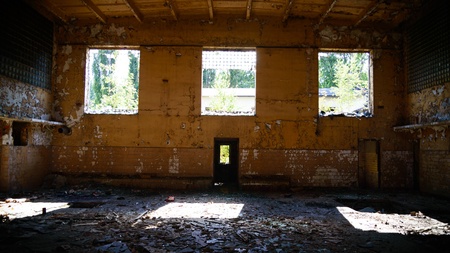 discarded ruin with old windows and wall, industrial window in concrete wallの写真素材