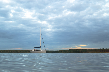 boat on the blue lake with cloudy sky, nature seriesの写真素材