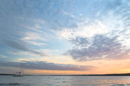 sun behind the clouds on a warm day, nature seriesの写真素材