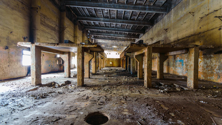 wide angle view of an old wall abandoned factory buildingの写真素材