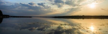 sun behind the clouds on a warm day, nature seriesの写真素材