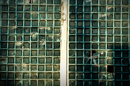 discarded ruin with old windows and wall, industrial window in concrete wallの写真素材