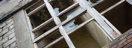 discarded ruin with old windows and wall, industrial window in concrete wall