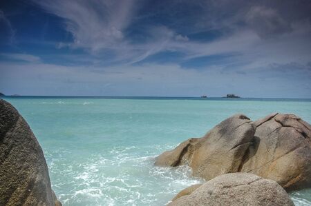 Stones in the waves of the indian ocean