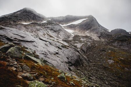 Norwegian mountain landscape during hiking to Halls Fortopp peak, with a view on Stetind, Northern Norway, Nordland county, municipality of Tysfjord, Ofoten, with fjord and lakeの写真素材