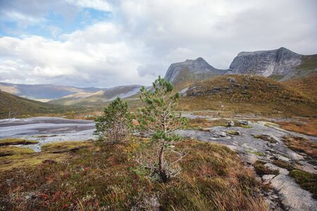 Norwegian mountain landscape during hiking to Halls Fortopp peak, with a view on Stetind, Northern Norway, Nordland county, municipality of Tysfjord, Ofoten, with fjord and lakeの写真素材