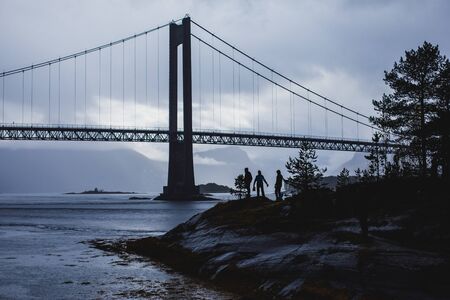Classic Norwegian cold panoramic landscape of Efjorden fjord, Ballangen municipality, Nordland county, Ofoten district, Norway with Efjord Bridges, Stortinden mountain, Northern Norwayの写真素材