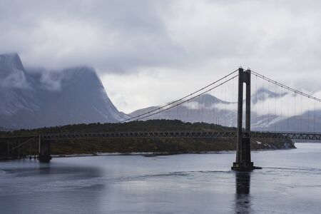 Classic Norwegian cold panoramic landscape of Efjorden fjord, Ballangen municipality, Nordland county, Ofoten district, Norway with Efjord Bridges, Stortinden mountain, Northern Norwayの写真素材
