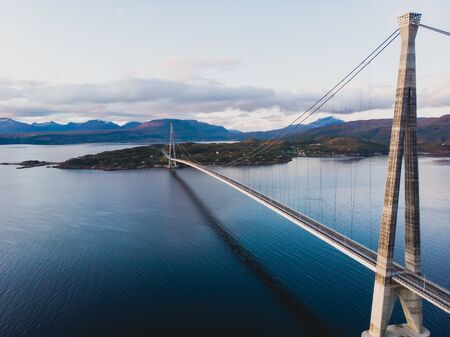 Aerial view of a Halogaland suspension bridge which crosses the Rombaksfjorden in Narvik Municipality in Nordland county, Norway, part of the European Route E6 highwayの写真素材