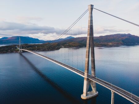 Aerial view of a Halogaland suspension bridge which crosses the Rombaksfjorden in Narvik Municipality in Nordland county, Norway, part of the European Route E6 highwayの写真素材